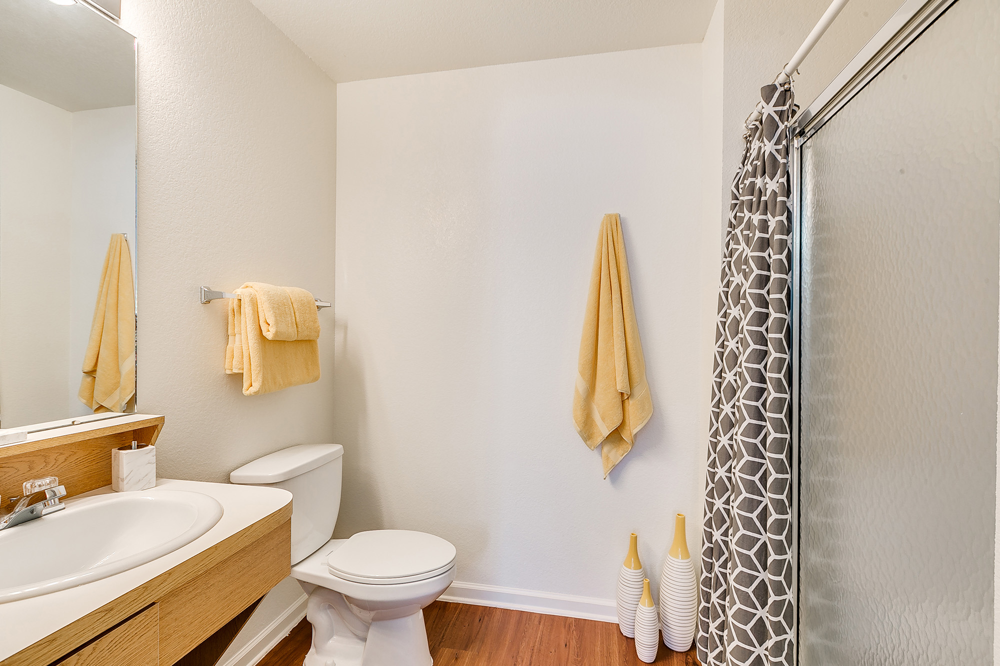 a bathroom with a shower and toilet