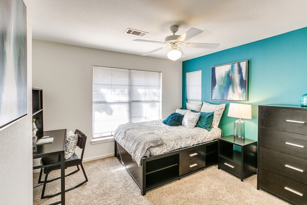 Clean bedroom with teal accent wall