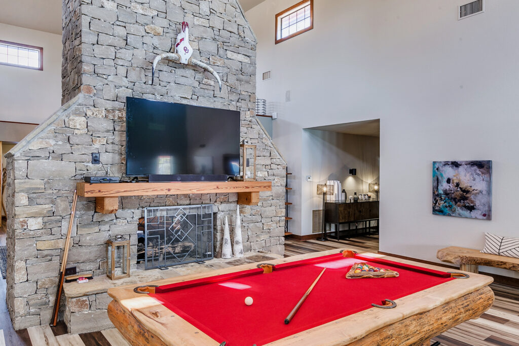 Lodge like clubhouse with television and pool table