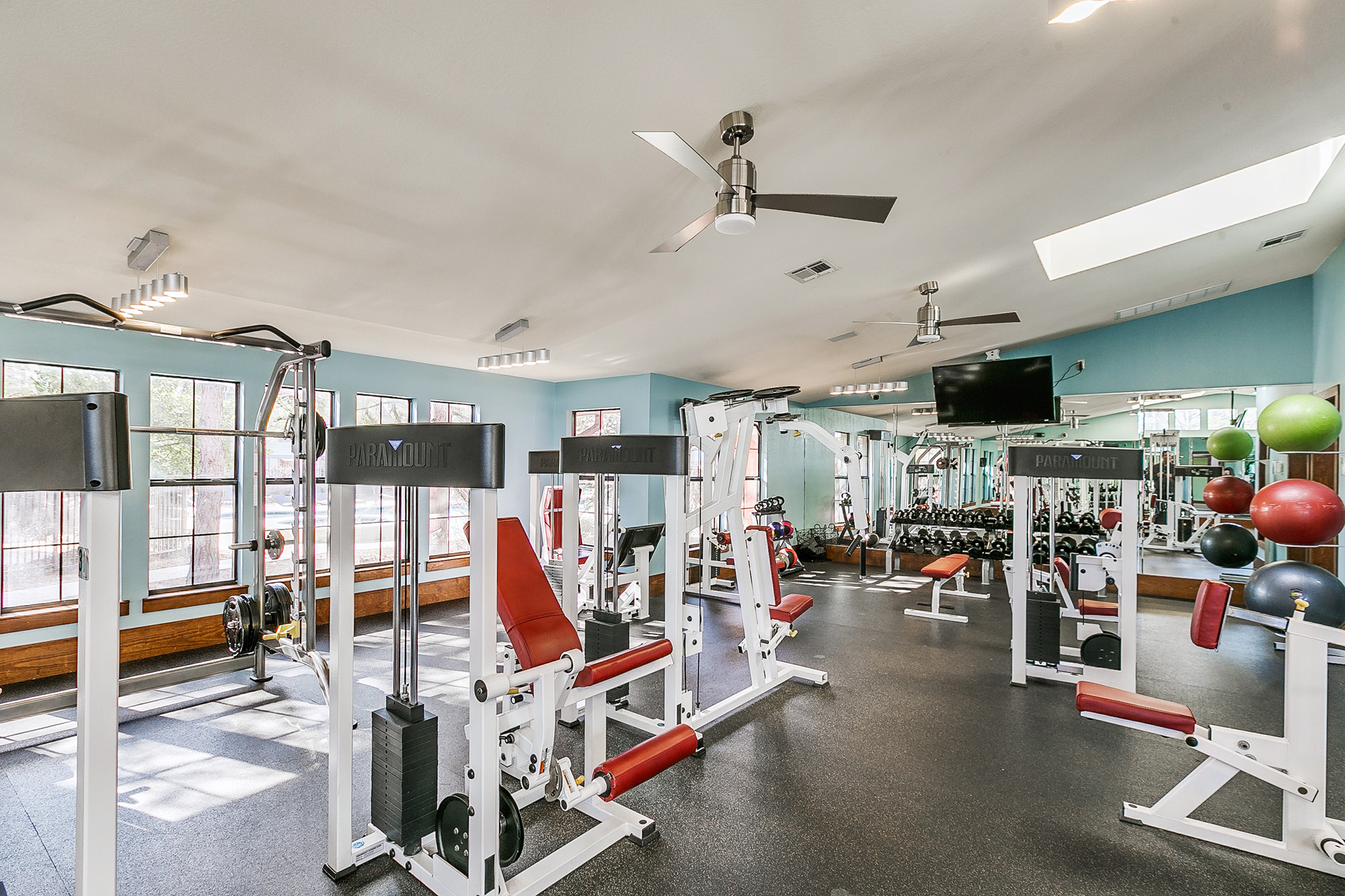 a large gym with several exercise equipment