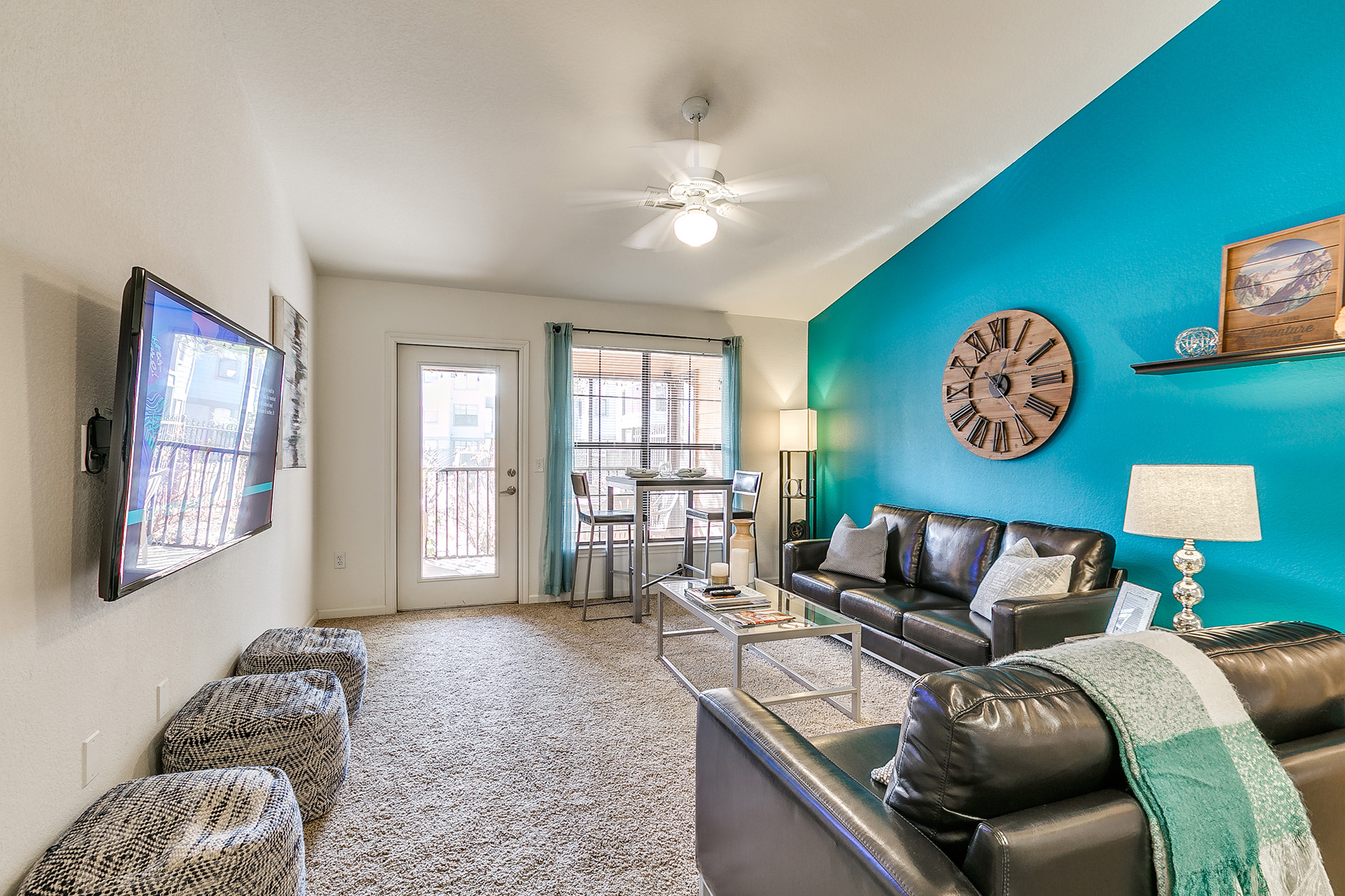 a living room with a blue wall and a couch