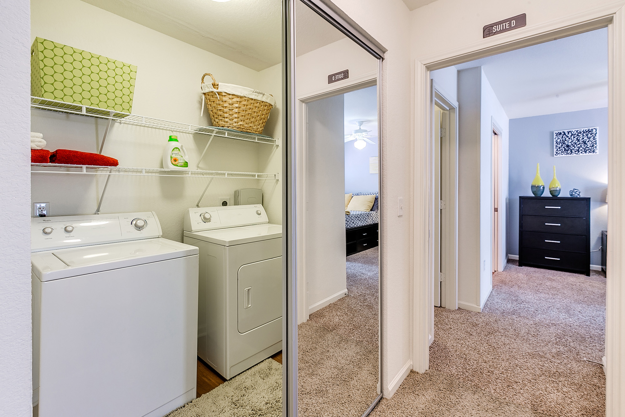 a laundry room with a mirror