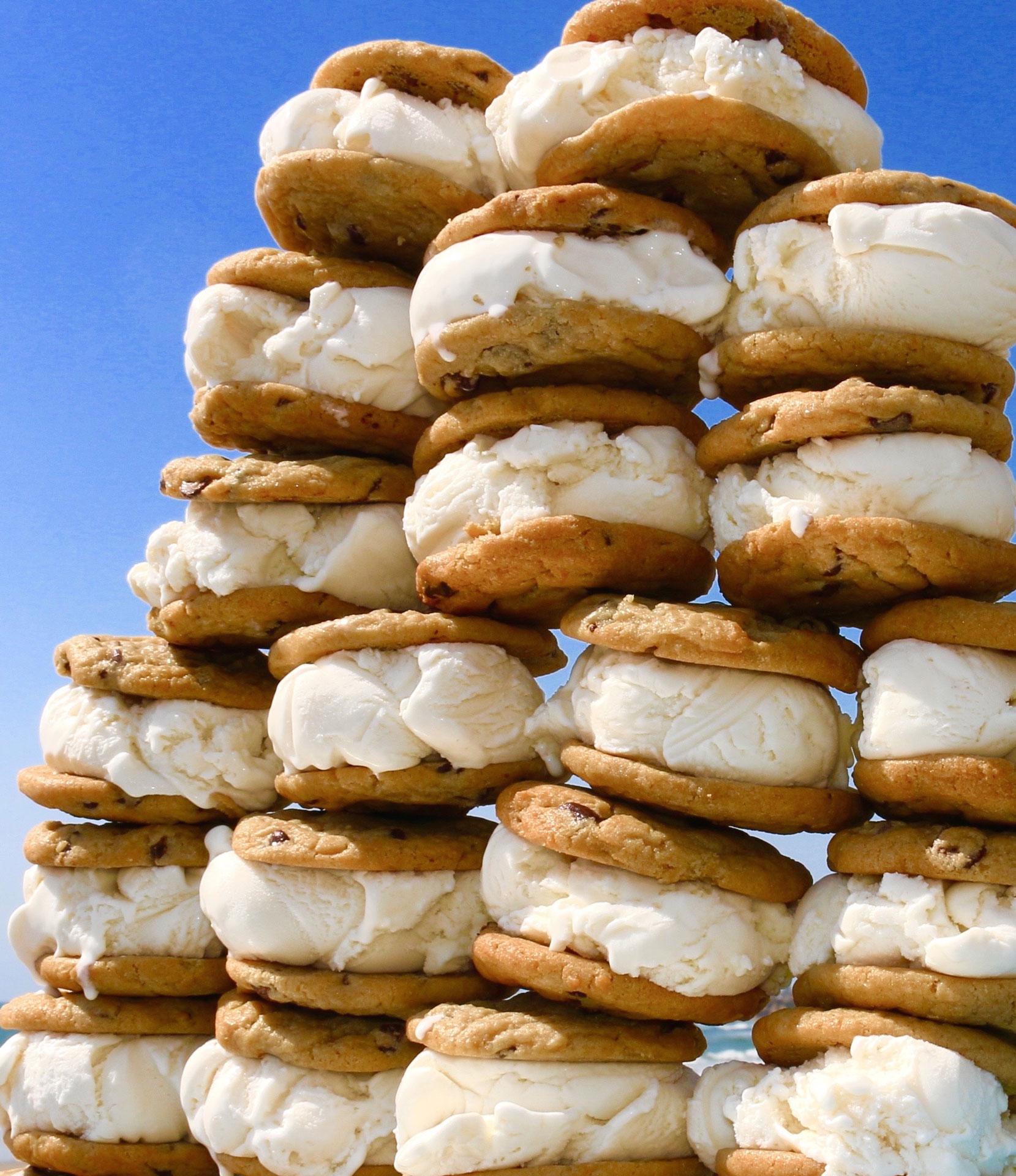 a stack of cookies with ice cream on them